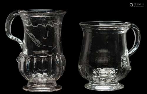 Two English glass tankards: one of bell shaped form with exterior basal ribs and set on a flaring