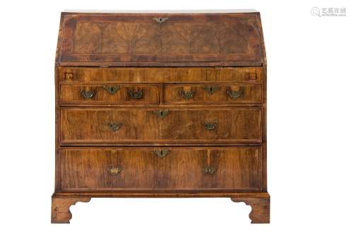An early 18th Century walnut and cross and feather banded bureau:,