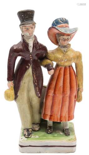 A Staffordshire pearlware group 'The Dandies': the fashionable lady holding a handbag,