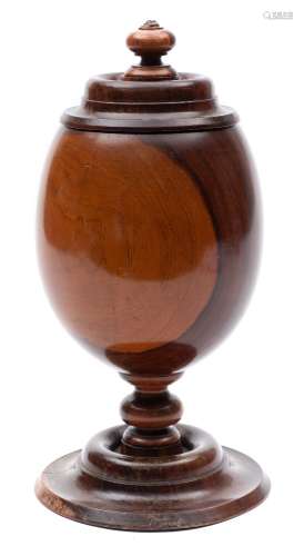 A 19th century turned lignum vitae cup and cover: of ovoid form, on knopped stem and circular base,