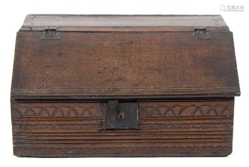 A late 17th Century oak bible box:, having a sloping hinged top with reeded bands and dentil edges,