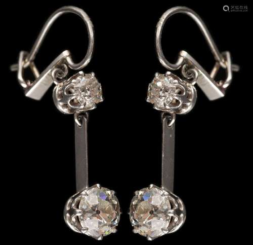 A pair of diamond two-stone drop earrings: each with a round old,