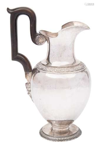 A Continental silver wine ewer: of baluster form with banded floral decoration,