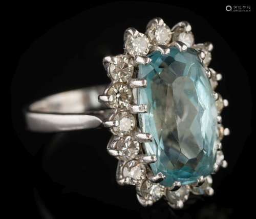 An aquamarine and diamond oval cluster ring: the oval aquamarine approximately 15mm wide x 9mm wide