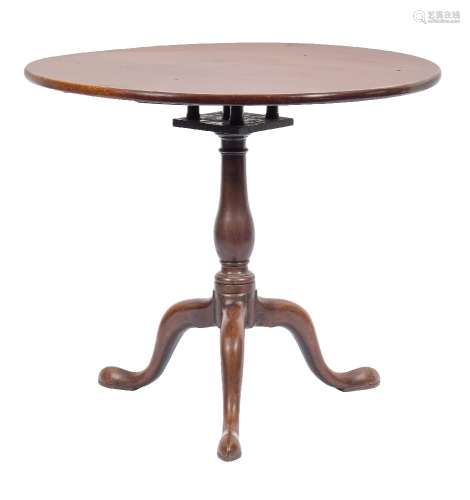 A mid 18th Century mahogany circular tea table:, with a snap top on turned baluster column,