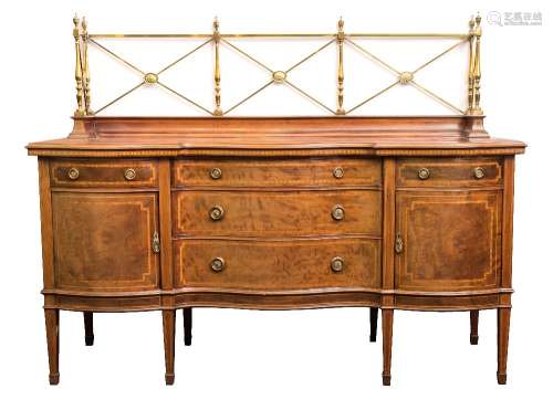 An Edwardian mahogany and inlaid sideboard:, of serpentine fronted outline,