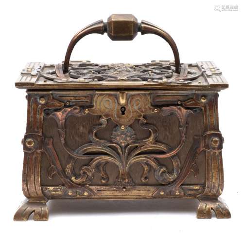 A Continental Art Nouveau period brass and copper casket: the hinged lid with loop carrying handle