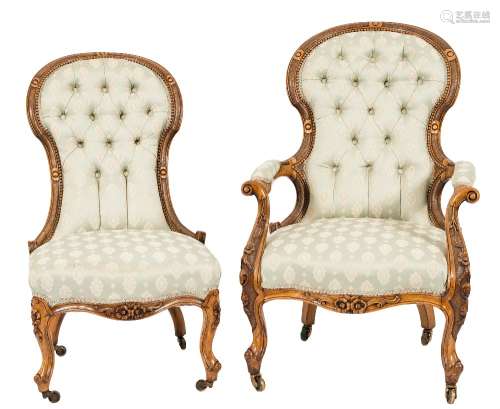 A Gentleman's Victorian carved walnut open armchair:,