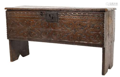 A 17th Century oak rectangular plank coffer:, with a plain hinged top,