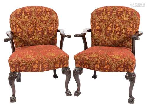 A pair of carved mahogany open armchairs in the George II taste:,