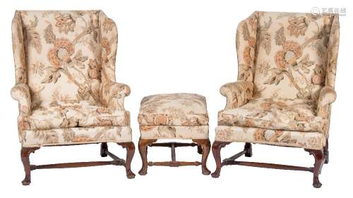 A pair of stained mahogany wing armchairs:, in the early 18th Century taste,