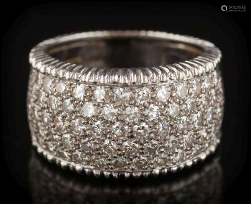 An 18ct white gold and diamond band cluster ring: with a 10mm wide band,
