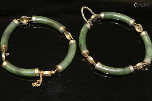 A pair of Chinese spinach jade bracelets.