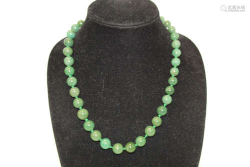 Chinese spinach jade bead necklace.