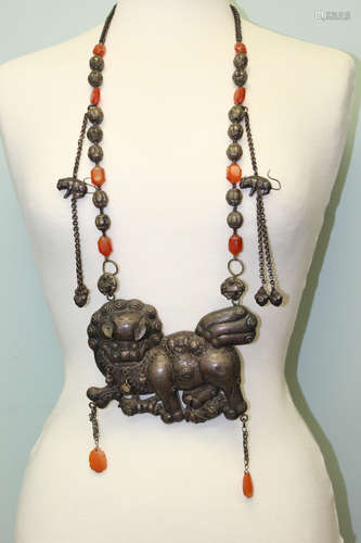 A very rare Chinese silver necklace with large silver foo dog pendant.