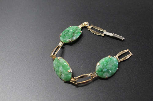 14 k gold and jadeite bracelet.