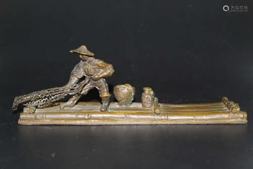 Japanese bronze statue of a fisherman on a raft.