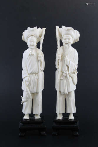 Two Chinese carved bone figurines of old man and woman.