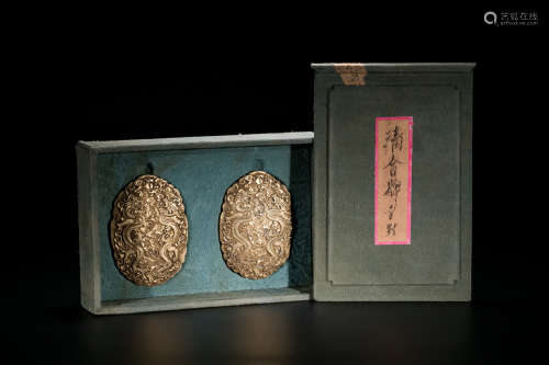 A pair of Chinese imperial gilt silver plaques.