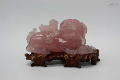 Chinese carved rose quartz foo dogs.