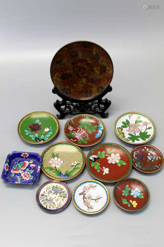 A group of Chinese cloisonne dishes.