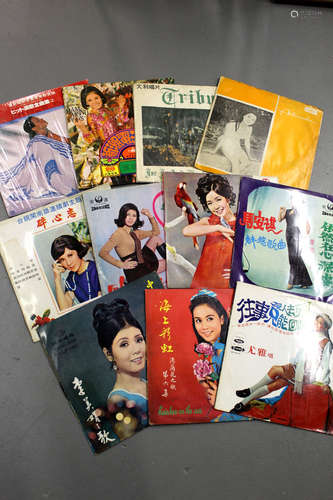 A group of 11 old Chinese LP music disks.