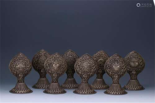 A SET OF EIGHT SILVER BUDDHIST RITUAL ITEMS