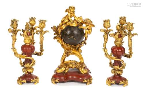A French Gilt Bronze and Rouge Marble Clock Garniture