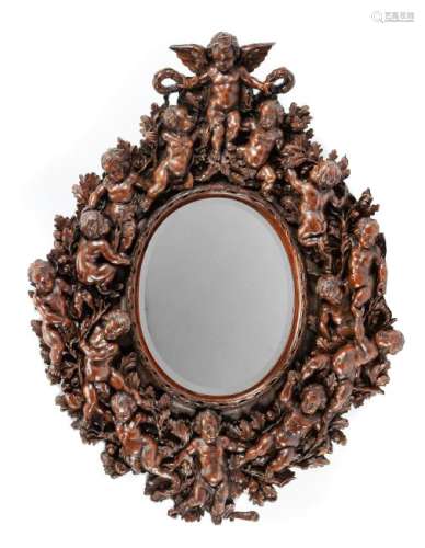 An Italian Renaissance Revival Carved Walnut Mirror