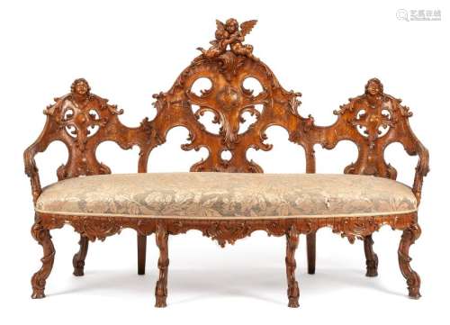 A Black Forest Carved Walnut Settee Height 47 1/2 x