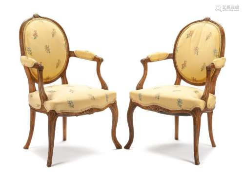 A Pair of George III Walnut Armchairs Height 35 inches.