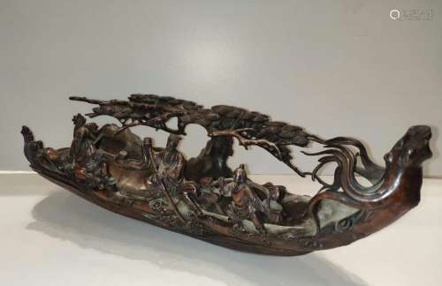 Intricately Carved Bamboo Boat with Figures