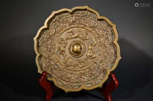 A CARVED BRONZE MIRROR