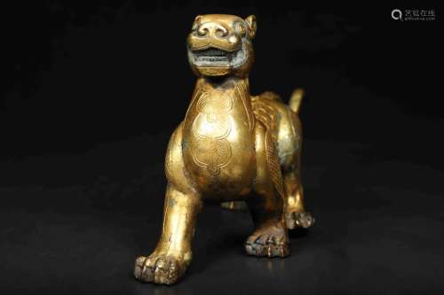 A GILT-BRONZE FIGURE OF MYTHICAL