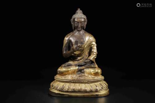 A GILT-BRONZE OF SHAKYAMUNI