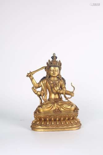 A GILT-BRONZE FIGURE OF MANJUSHRI