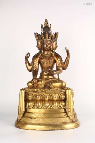 A GILT-BRONZE FIGURE OF USHNISHAVJAYA