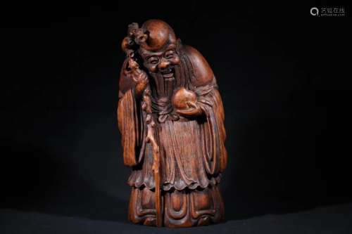 A BAMBOO CARVED FIGURE OF LIFE GOD