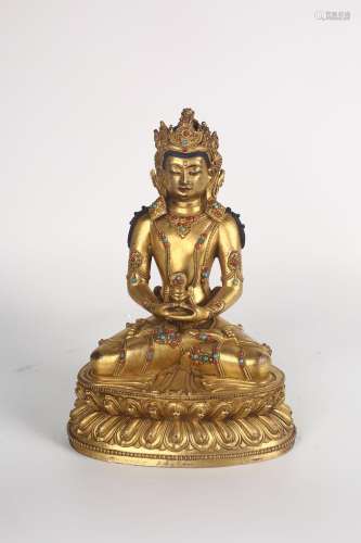 A GILT-BRONZE FIGURE OF BUDDHA