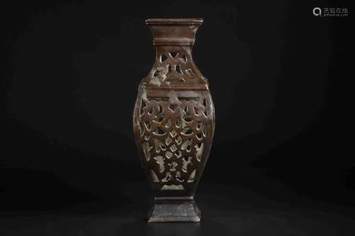 A BRONZE CARVED VASE