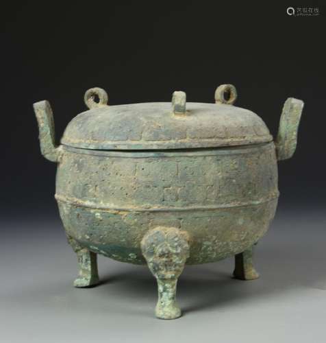 AN ANTIQUE BRONZE TRIPOD CENSER