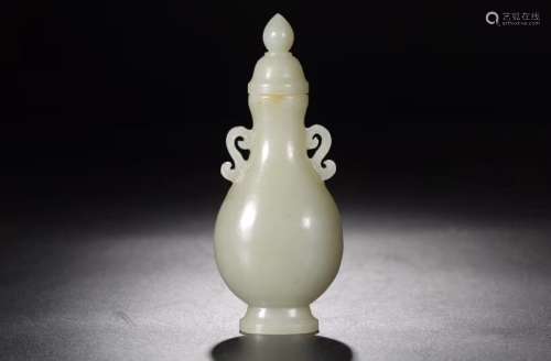 A JADE CARVED VASE AND COVER