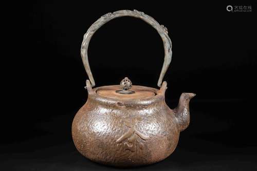 AN IRON TEA POT