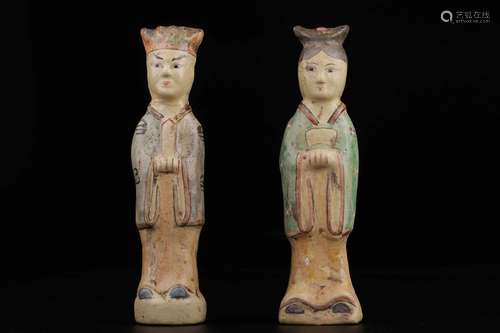 A PAIR OF POTTERY FIGURE