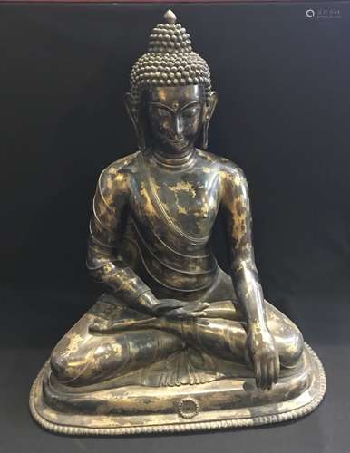 A GILT BRONZE FIGURE OF SHAKYAMUNI