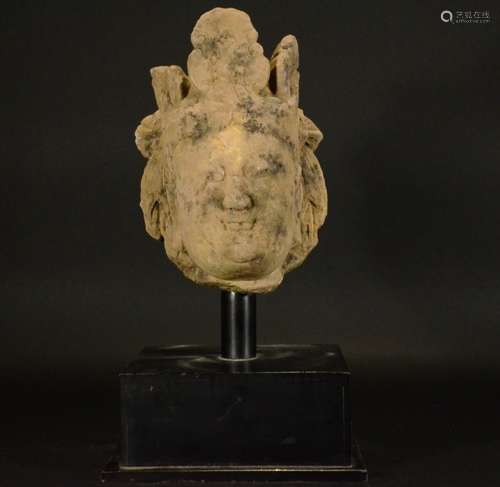 A GUANYIN CARVED STONE HEAD