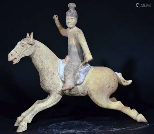 A WARRIOR POTTERY RIDING HORSE