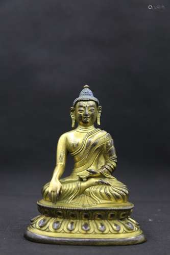 A GILT-BRONZE FIGURE OF SHAKYAMUNI