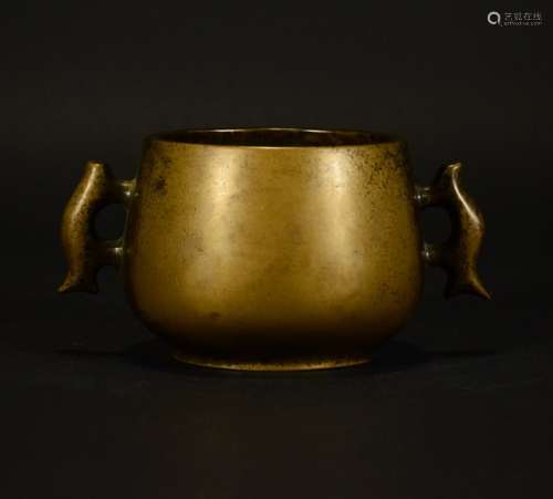 A BRONZE CENSER WITH TWO EARS