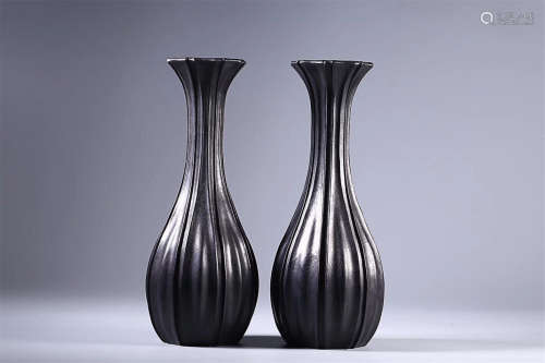 A PAIR OF ROSEWOOD VASES